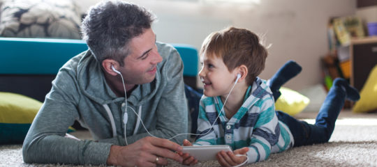 Father and son listening music